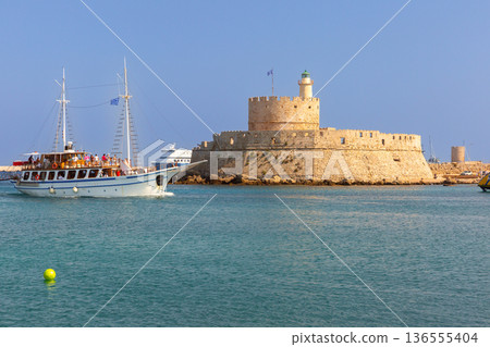 St Nicholas Fortress and Tourist Boat in Rhodes Harbor, Greece St Nicholas Fortress and Tourist Boat in Rhodes Harbor, Greece 136555404