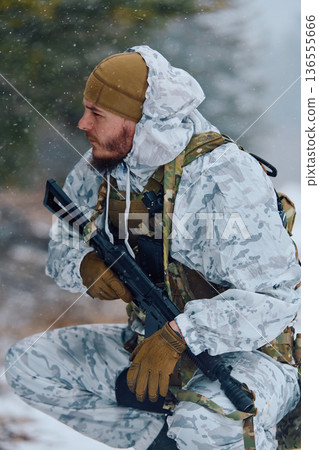 Winter Soldier In White Snow Camouflage Holding Rifle During Tactical Patrol In Forest 136555666