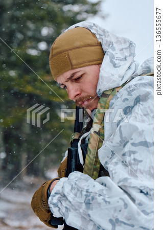 Soldier In Winter Camouflage With Rifle Preparing Gear During Snowy Training Patrol 136555677