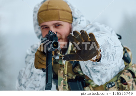 Soldier in White Snow Camo Aiming Rifle in Winter Forest Tactical Portrait 136555749