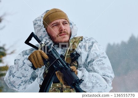 Armed Soldier in White Winter Camouflage Holding Rifle in Snowy Forest Patrol Armed Soldier in White Winter Camouflage Holding Rifle in Snowy Forest Patrol 136555770