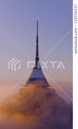 Beautiful Sunset over Famous Mountain Hotel Jested , Aerial Shot Above Clouds Beautiful Sunset over Famous Mountain Hotel Jested , Aerial Shot Above Clouds 136556257