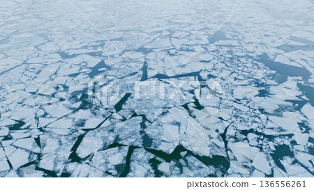 Floating ice Floes on the Frozen Surface of the River in Winter , Aerial Shot Floating ice Floes on the Frozen Surface of the River in Winter , Aerial Shot 136556261