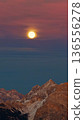 Panorama of the Dolomites mountains with full moon during sunset. Beautiful mountians of Alpi Dolomiti in Italy, South Tirol 136556278