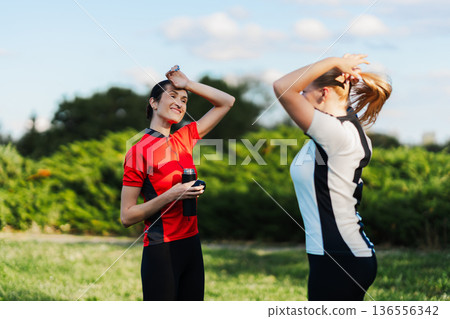 Friends take a break during sports 136556342