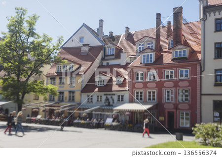 Riga Old Town view, Latvia, streets of Vecriga historical center with Town Hall square, House Of The Black Heads, Cathedral and church, travel to Latvia and Baltic States, summer day with a blue sky Riga Old Town view, Latvia, streets of Vecriga historical center with Town Hall square, House Of The Black Heads, Cathedral and church, travel to Latvia and Baltic States, summer day with a blue sky 136556374