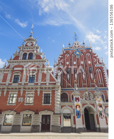 Riga Old Town view, Latvia, streets of Vecriga historical center with Town Hall square, House Of The Black Heads, Cathedral and church, travel to Latvia and Baltic States, summer day with a blue sky Riga Old Town view, Latvia, streets of Vecriga historical center with Town Hall square, House Of The Black Heads, Cathedral and church, travel to Latvia and Baltic States, summer day with a blue sky 136556386
