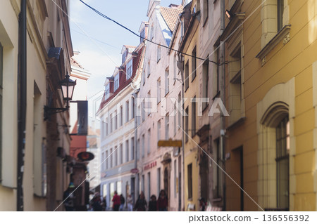 Riga Old Town view, Latvia, streets of Vecriga historical center with Town Hall square, House Of The Black Heads, Cathedral and church, travel to Latvia and Baltic States, summer day with a blue sky Riga Old Town view, Latvia, streets of Vecriga historical center with Town Hall square, House Of The Black Heads, Cathedral and church, travel to Latvia and Baltic States, summer day with a blue sky 136556392