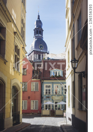 Riga Old Town view, Latvia, streets of Vecriga historical center with Town Hall square, House Of The Black Heads, Cathedral and church, travel to Latvia and Baltic States, summer day with a blue sky Riga Old Town view, Latvia, streets of Vecriga historical center with Town Hall square, House Of The Black Heads, Cathedral and church, travel to Latvia and Baltic States, summer day with a blue sky 136556393