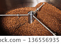 Cooling drum of a roasting machine with full of fresh coffee beans  136556935