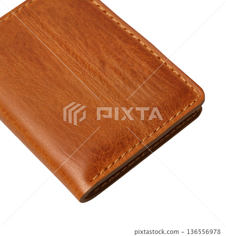 Leather Wallet Lying on a Table in a Bright Room During the Day 136556978