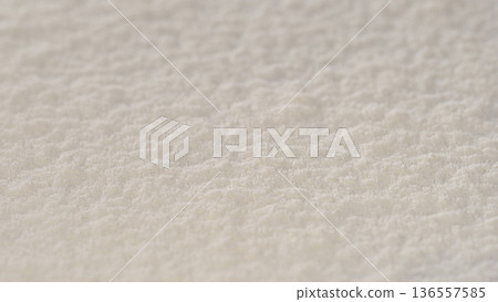 Surface of fine white powder on a flat surface seen from a close distance during daylight hours Surface of fine white powder on a flat surface seen from a close distance during daylight hours 136557585