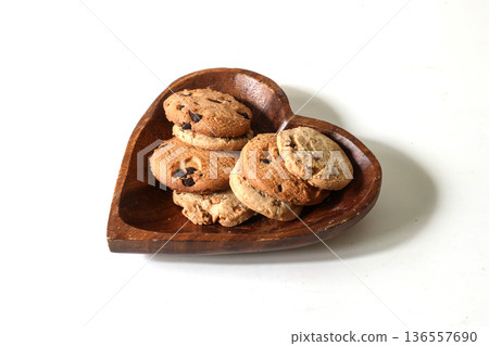 Cookies in a wooden bowl on a white background 136557690
