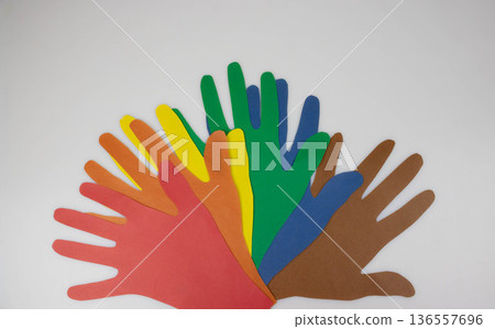 Paper hands on a light background. The concept of friendship and mutual assistance between nations Paper hands on a light background. The concept of friendship and mutual assistance between nations 136557696