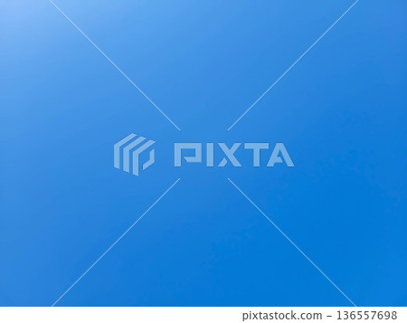A beautiful blue sky with a sunbeam on a clear summer day A beautiful blue sky with a sunbeam on a clear summer day 136557698