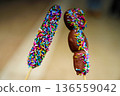 Chocolate banana, color spray, colorful sweets, festival stall, sweets photo Chocolate banana, color spray, colorful sweets, festival stall, sweets photo 136559042