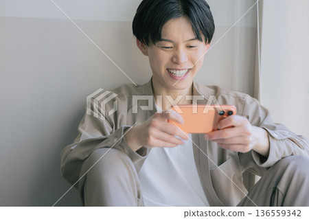 Men looking at smartphones 136559342