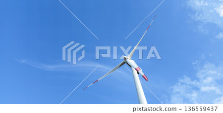 Side View of Windmill or Wind turbine generator for eco energy in power plant Side View of Windmill or Wind turbine generator for eco energy in power plant 136559437