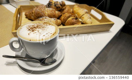 Delicious Coffee and Croissants on a Breakfast Table Delicious Coffee and Croissants on a Breakfast Table 136559440
