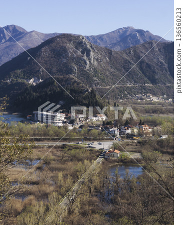 Skadar Lake National park panoramic landscape, Montenegro, Hiking in Skadar Lake, Skadarsko jezero, also called Shkodra or Scutari, with mountains and village in a sunny day, Montenegrin Balkan nature Skadar Lake National park panoramic landscape, Montenegro, Hiking in Skadar Lake, Skadarsko jezero, also called Shkodra or Scutari, with mountains and village in a sunny day, Montenegrin Balkan nature 136560213