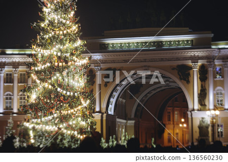 Christmas tree on Palace square, Saint-Petersburg, New Year and Christmas in Russia, glowing decor decoration in a winter snowy street, with night decor illumination, city outdoor lights and garlands 136560230