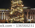 Christmas tree on Palace square, Saint-Petersburg, New Year and Christmas in Russia, glowing decor decoration in a winter snowy street, with night decor illumination, city outdoor lights and garlands 136560231
