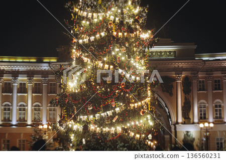 Christmas tree on Palace square, Saint-Petersburg, New Year and Christmas in Russia, glowing decor decoration in a winter snowy street, with night decor illumination, city outdoor lights and garlands Christmas tree on Palace square, Saint-Petersburg, New Year and Christmas in Russia, glowing decor decoration in a winter snowy street, with night decor illumination, city outdoor lights and garlands 136560231