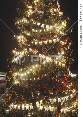Christmas tree on Palace square, Saint-Petersburg, New Year and Christmas in Russia, glowing decor decoration in a winter snowy street, with night decor illumination, city outdoor lights and garlands Christmas tree on Palace square, Saint-Petersburg, New Year and Christmas in Russia, glowing decor decoration in a winter snowy street, with night decor illumination, city outdoor lights and garlands 136560232