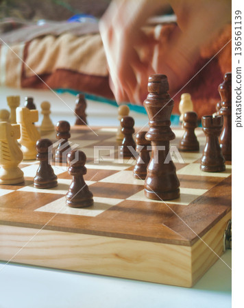 Budapest Interior Lifestyle Chess Game with Motion Blur Hand Moving Piece on Wooden Board under Bright Morning Light Residential Home Strategy Hungary Zuglo District View Budapest Interior Lifestyle Chess Game with Motion Blur Hand Moving Piece on Wooden Board under Bright Morning Light Residential Home Strategy Hungary Zuglo District View 136561139