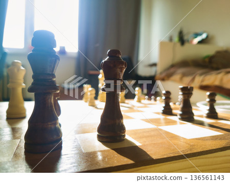 Budapest Home Lifestyle Chess Game with Two Queens in Focus and Winning Child Dancing in Blurred Background Morning Light Interior Family Joy Hungary View 199 Characters Budapest Home Lifestyle Chess Game with Two Queens in Focus and Winning Child Dancing in Blurred Background Morning Light Interior Family Joy Hungary View 199 Characters 136561143
