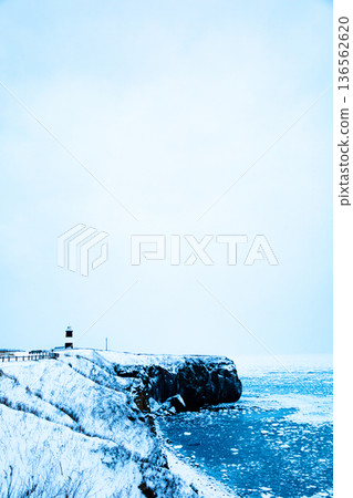 Notoro Cape Lighthouse in Abashiri, Hokkaido, in winter, and drift ice ashore in the Sea of Okhotsk 136562620