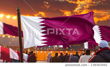 Qatar Flag Waving at Sunset by the Sea 136563442