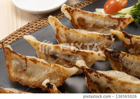 Freshly baked delicious gyoza Freshly baked delicious gyoza 136565026