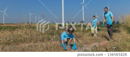 Family collecting garbage at park 136565826