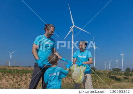 Family collecting garbage at park 136565832