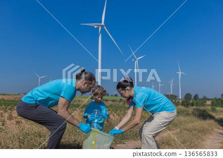 Family collecting garbage at park Family collecting garbage at park 136565833