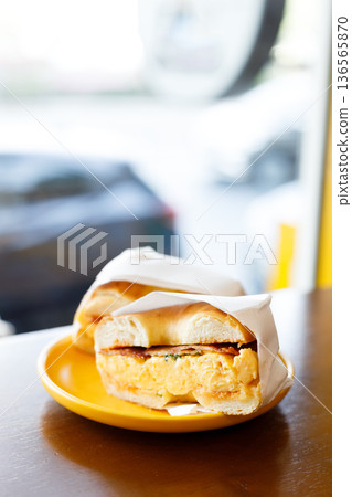 Bagel bread with scrambled egg and bacon. Bagel bread with scrambled egg and bacon. 136565870