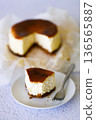 Cheesecake with baking paper on white marble table. 136565887