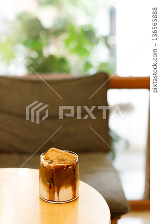 Iced latte coffee on top with biscuit. 136565888