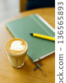 Cup of coffee latte art on wood table. 136565893