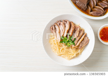 dried noodles with stewed duck in white bowl dried noodles with stewed duck in white bowl 136565903
