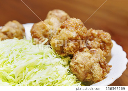 Close-up of a pile of fried chicken and shredded cabbage Close-up of a pile of fried chicken and shredded cabbage 136567269