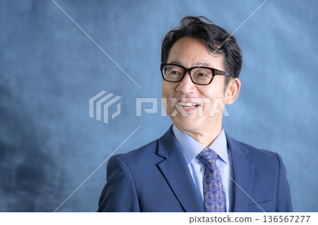 A cool-looking man with glasses who looks like a business owner A cool-looking man with glasses who looks like a business owner 136567277
