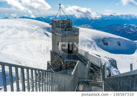 Klein Matterhorn observation deck and elevator shaft on snowy peak. Zermatt, canton Valais, Switzerland. 136567310