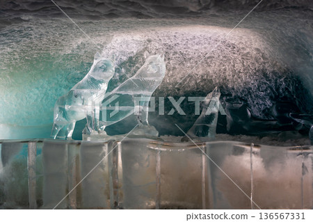 Ice tunnel and ice sculptures at the Matterhorn Glacier Paradise Ice Palace. Zermatt, Valais, Switzerland Ice tunnel and ice sculptures at the Matterhorn Glacier Paradise Ice Palace. Zermatt, Valais, Switzerland 136567331