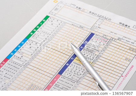 Tax return form and ballpoint pen Tax return form and ballpoint pen 136567907