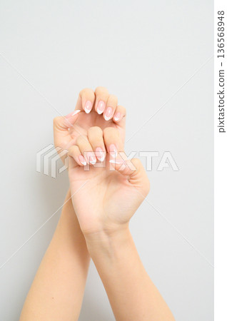 Woman's hands with French nails 136568948