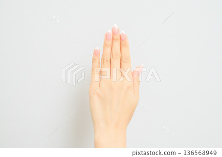 Woman's hands with French nails Woman's hands with French nails 136568949