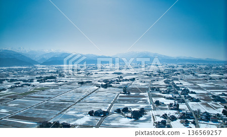 A slight snow melt on the Kurobe River alluvial fan and coastline in Toyama Prefecture, Japan 136569257