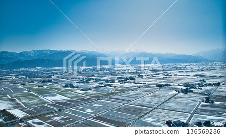 A slight snow melt on the Kurobe River alluvial fan and coastline in Toyama Prefecture, Japan 136569286